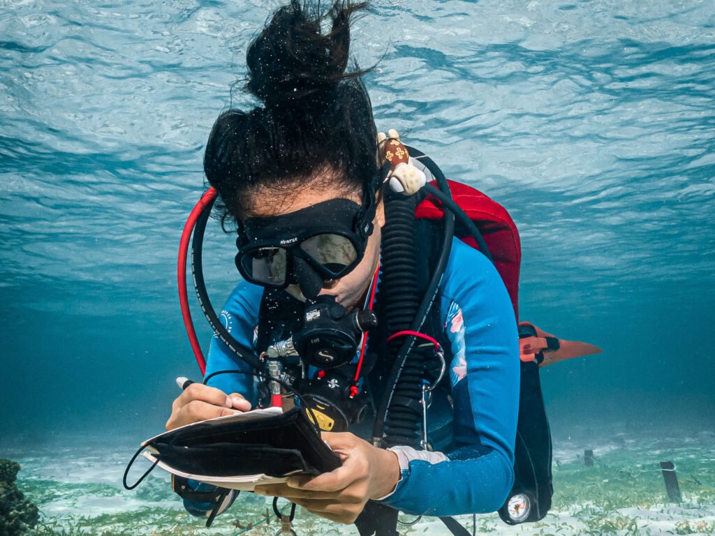 Nori, the GaiaOne founder, doing a reef survey during a dive